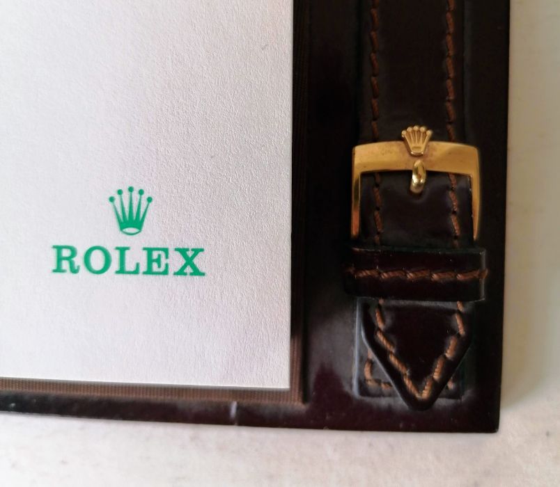 A vintage Rolex dealer's quote leather notepad with crested buckles, 20.5 x 16.5 cm, no pen 