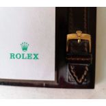 A vintage Rolex dealer's quote leather notepad with crested buckles, 20.5 x 16.5 cm, no pen