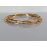 Seven yellow gold bangles with bamboo texture decoration, 60mm, each stamped 14k, 15.8g