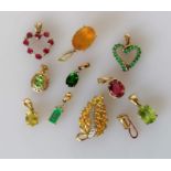 A selection of eleven gem-set gold pendants, all hallmarked 9ct, 16.3g