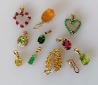 A selection of eleven gem-set gold pendants, all hallmarked 9ct, 16.3g