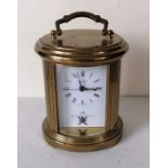 A Matthew Norman quartz brass mantle clock, 12 cm H without handle, needs battery, with original box