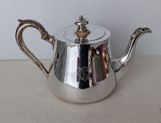 A Victorian silver teapot with acanthus leaf decoration, ivory insulators, crested