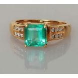 A square-cut emerald ring on an 18ct yellow gold claw setting by Iliana, emerald 7 x 7mm