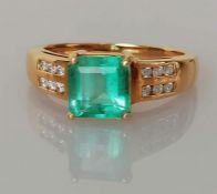 A square-cut emerald ring on an 18ct yellow gold claw setting by Iliana, emerald 7 x 7mm