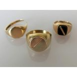 Three gents 9ct gold signet rings, two cut, one unmarked but tests for 9ct, size Y