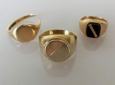 Three gents 9ct gold signet rings, two cut, one unmarked but tests for 9ct, size Y