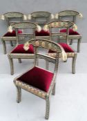 A set of six Indian bone inlay chairs with carved tiger head and floral decoration to supports, fabr