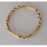 A yellow and white gold bracelet with rope-twist baton links and lobster clasp, Egyptian hallmarks