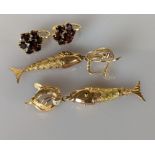 A pair of yellow gold articulated fish earrings with ruby decoration, each 60mm