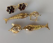 A pair of yellow gold articulated fish earrings with ruby decoration, each 60mm 