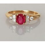 An 18ct yellow gold ruby and diamond ring by Iliana in a claw setting