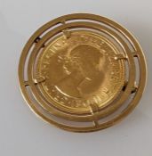 A QEII gold sovereign, 1968, in an 18ct gold mount, 13.6g