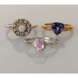 Three 14ct gold rings: a diamond cluster ring on a white gold claw setting,