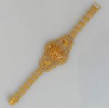 A high carat gold filigree bracelet with pierced cabochon to centre, 17.5 cm, stamped