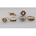 Four gem-set rings stamped or testing for 18ct gold, 8g; a 9ct gold opal and garnet ring