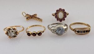 Four gem-set rings stamped or testing for 18ct gold, 8g; a 9ct gold opal and garnet ring