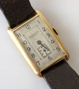 An Art Deco gold tank watch with silvered oblong dial, 25 x 16mm, Arabic numerals