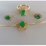 An emerald and diamond parure comprising a gold snake-link necklace (42 cm) with pendant