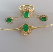 An emerald and diamond parure comprising a gold snake-link necklace (42 cm) with pendant