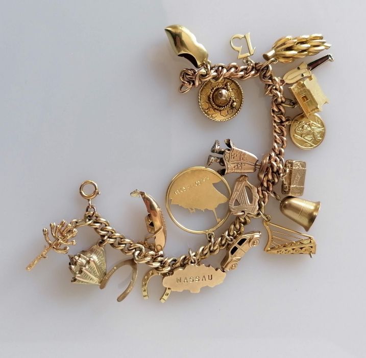 A gold charm bracelet, all hallmarked 9ct, 48.8g - Image 2 of 2