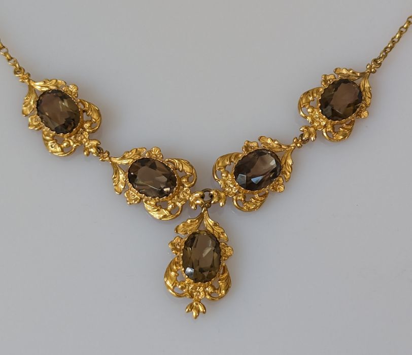 An Edwardian citrine and yellow gold integrated necklace, the mixed oval-cut citrines