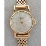 An International Watch Co. ladies manual dress watch with raised baton markers, champagne dial, 17mm
