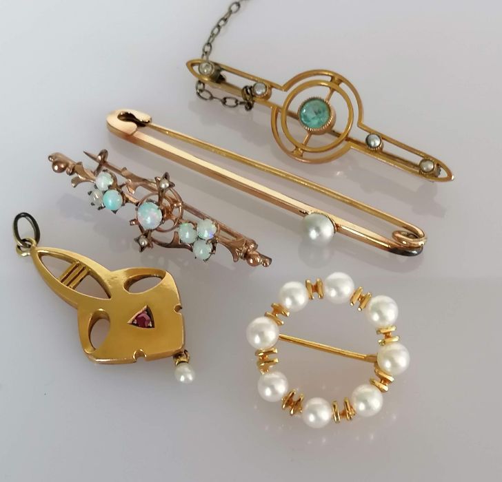 A selection of five early 20th century 9ct gold brooches with opal and seed pearl decoration