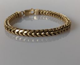 A 9ct yellow gold fancy-link herringbone bracelet with lobster clasp, stamped 9ct, 18 cm, 28.8g