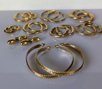 Two yellow gold carved bangles and eight pairs of gold earrings, all hallmarked 9ct