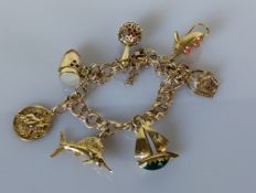 An Italian 14k yellow gold charm bracelet with 14k gold charms