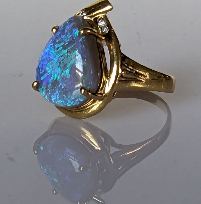 An Australian black opal ring in an 18ct gold claw setting with diamond decoration, 15 x 12mm - Image 6 of 7