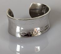 A Tiffany & Co. heavy silver bangle dated 1997, stamped to both sides, 60mm, 104g