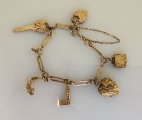 A 9ct gold charm bracelet, hallmarked