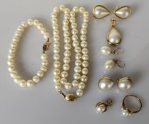 A cultured pearl necklace with 14ct gold clasp, 46 cm; a similar bracelet with yellow metal clasp, u