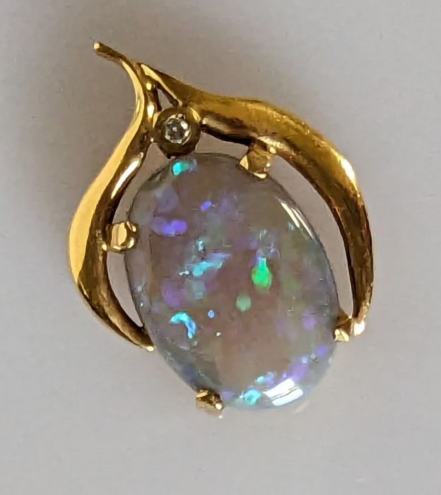 An Australian black opal ring in an 18ct gold claw setting with diamond decoration, 15 x 12mm - Image 7 of 7