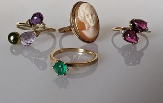 An emerald solitaire on a 14k gold setting, size L, 1.85g; a cameo ring and two gem-set rings