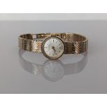 A ladies mid-century Longines manual dress watch in a 9ct gold case and bi-gold strap