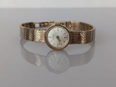 A ladies mid-century Longines manual dress watch in a 9ct gold case and bi-gold strap