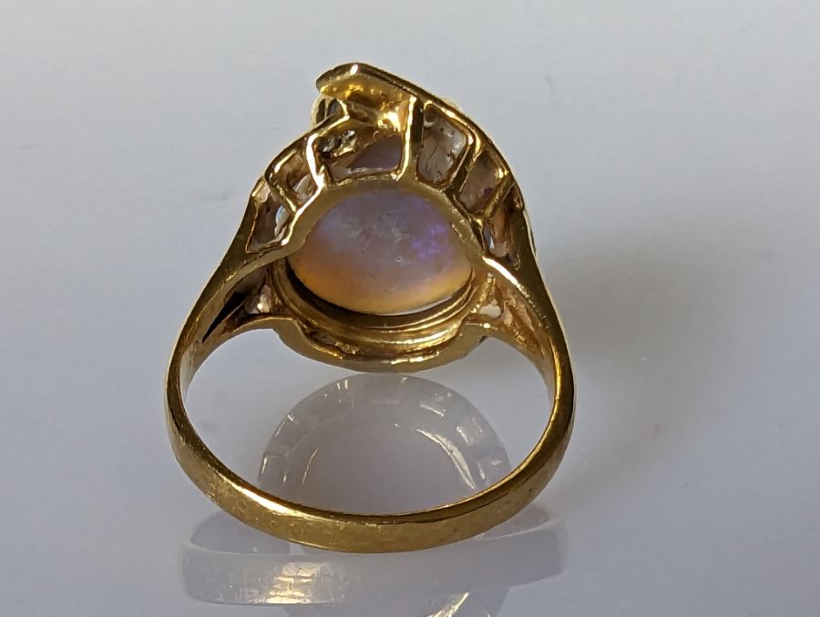 An Australian black opal ring in an 18ct gold claw setting with diamond decoration, 15 x 12mm - Image 5 of 7