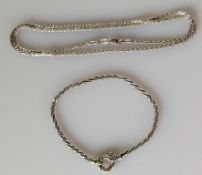 A white rope-twist gold necklace, 48 cm and similar bracelet, 18 cm, both hallmarked 9ct, 11g (2)