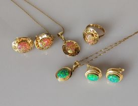 A synthetic opal pendant chain with matching earrings and ring, showing pink