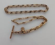 Two Edwardian fancy-link rose gold watch chains, one with T-bar and single lobster clasp, 37 cm