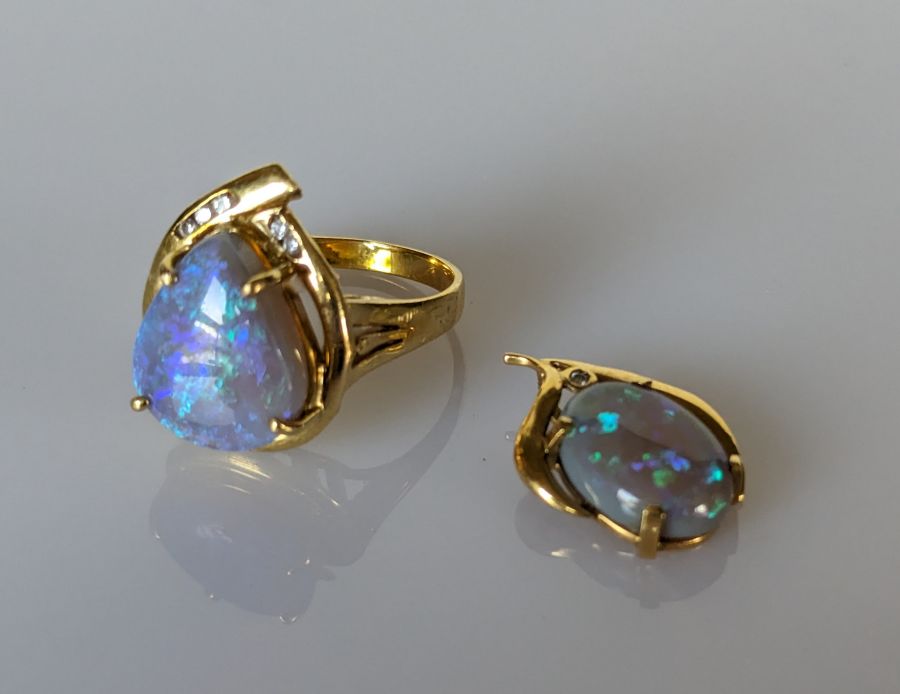 An Australian black opal ring in an 18ct gold claw setting with diamond decoration, 15 x 12mm - Image 2 of 7