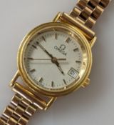 A mid-century Omega ladies dress watch with champagne dial, baton markers, date aperture