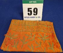 An Unbranded Beach Sarong in Orange Tie Die with Gold detailing and Tasselled Edge