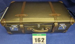 A GLOBE-TROTTER Caviar Medium Check-In Suitcase with Metallic High Shine Finish and Brown Leather