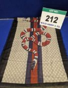 A GUCCI Scarf with Cream and Brown Double G Monogram Pattern to Background, Red and Blue Stripe
