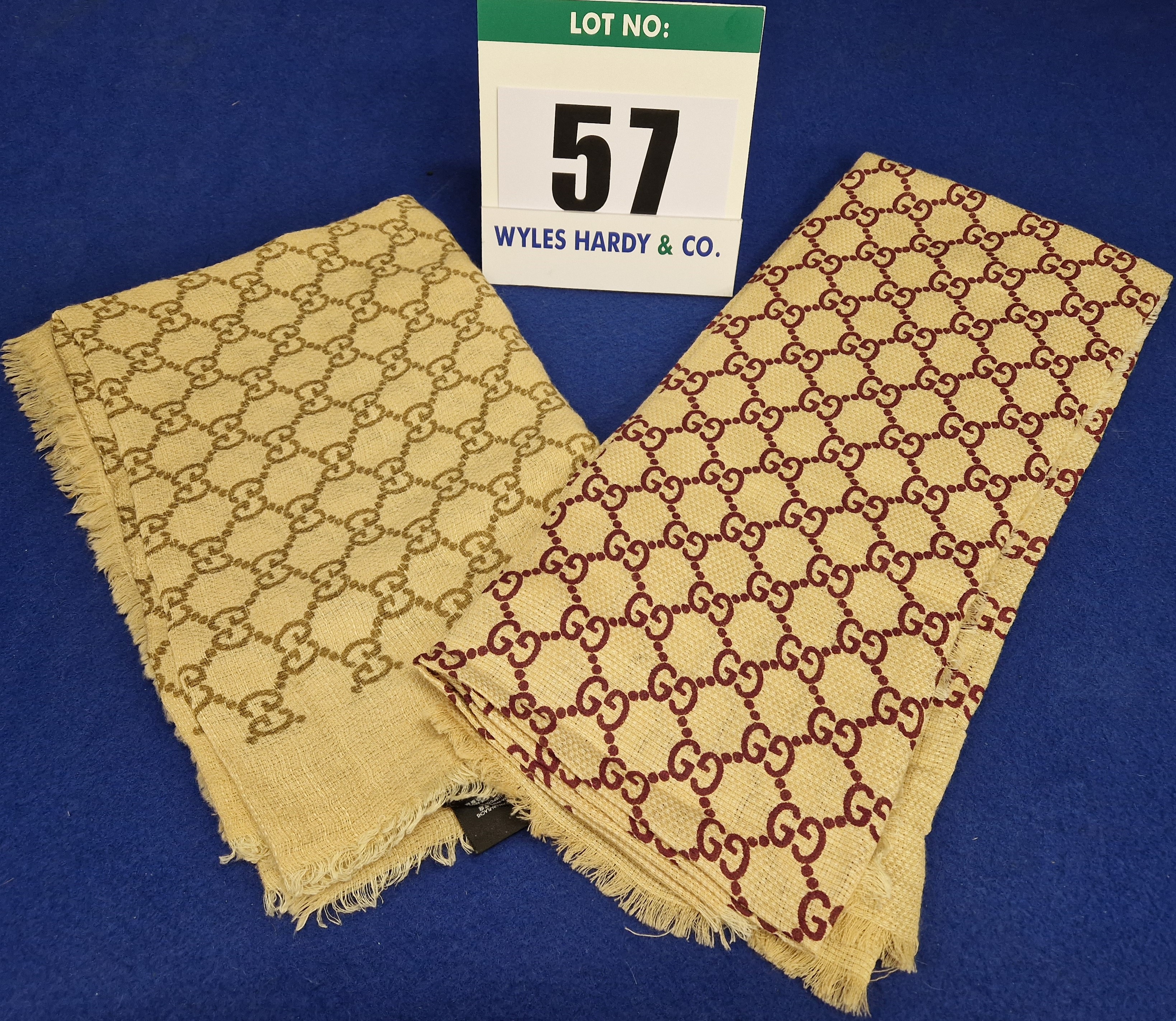 A Set of Two GUCCI Linen and Silk Scarves with Classic Double G Logo Print, One in Camel and Gold