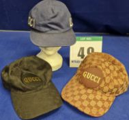 Three GUCCI Baseball Caps:- - A Black Embossed Double G Logo Canvas Cap with Leather GUCCI Logo